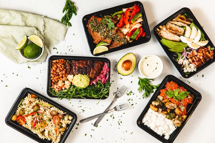 Deli Nerds to-go lunch box with sliders and sides in Costa Mesa